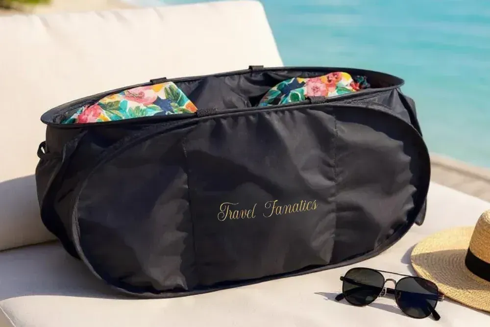 Travel Fanatics Collapsible Laundry Basket with three adjustable Velcro sections for organizing laundry into separate compartments.