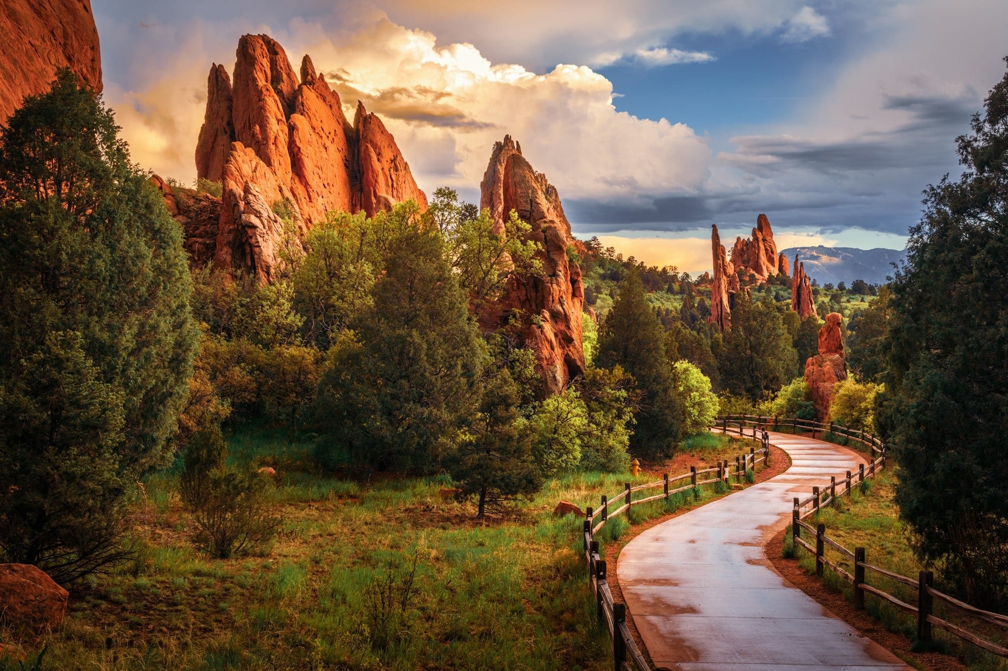 Road winding through a rocky landscape at sunset